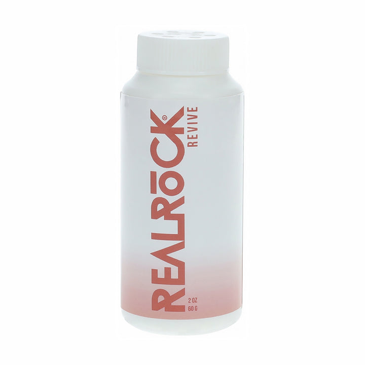 RealRock Revive Reviving Powder 2 oz bottle with white and pink gradient packaging for toy maintenance.