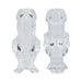 Clear tall shot glasses shaped like playful cartoon characters, designed as a humorous couples set.