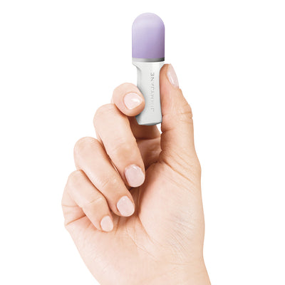 Hand holding a compact Jimmyjane Hello Touch Pro fingertip massager with a lavender silicone tip.