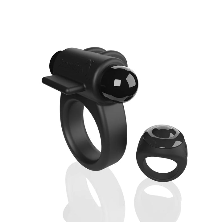 Black double-sided vibrating ring with detachable bullet and compact remote control on white background