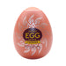 Tenga EGG Shiny II Hard Boiled textured male pleasure sleeve in orange with silver pattern and bold yellow text on front.