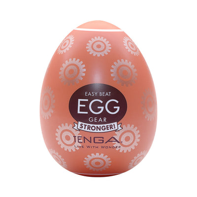 Tenga EGG Gear Stronger in orange with gear pattern, compact textured pleasure sleeve in egg-shaped packaging.