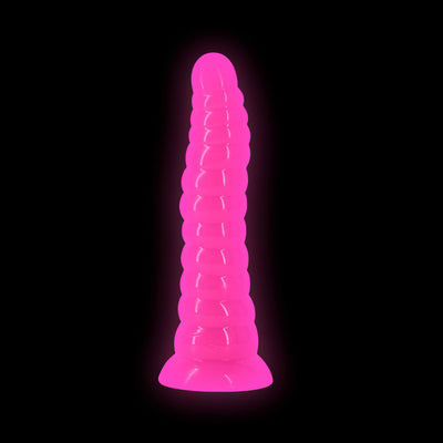 Glow-in-the-dark pink textured silicone dildo with a suction base on black background