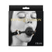 Packaging image of Fetish & Fashion Fran breathable black ball gag with adjustable strap and gold-tone hardware.