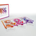 Our Sex Game Spanish edition with colorful game board, cards, dice, and play pieces for intimate couples' fun.