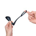 Hands holding and stretching a black flexible silicone b-Vibe Ringer C-Ring with attached prostate plug against a white background.