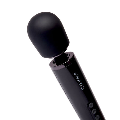 Black Le Wand Plugin vibrating massager with rounded head and control buttons on handle against white background.