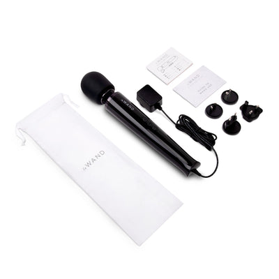 Le Wand Plugin Sky White black wand massager with power cord, multiple plug adapters, user guides, and white storage pouch on white background.