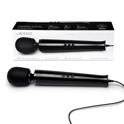 Le Wand Plugin Sky White powerful black plug-in vibrating massager with control buttons and long cord next to its packaging box.