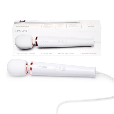 Le Wand Plugin Sky White powerful vibrating massager with silicone head and long cord displayed with packaging box.