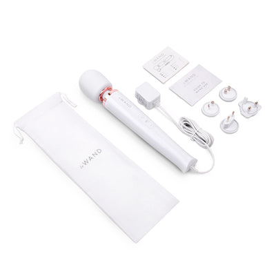 Le Wand Plugin Sky White massager with power adapter, international plugs, user guides, and branded storage pouch on white background.