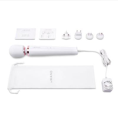 Le Wand Plugin Sky White massager with power cord, four plug adapters, user guides, and branded storage pouch on white background.