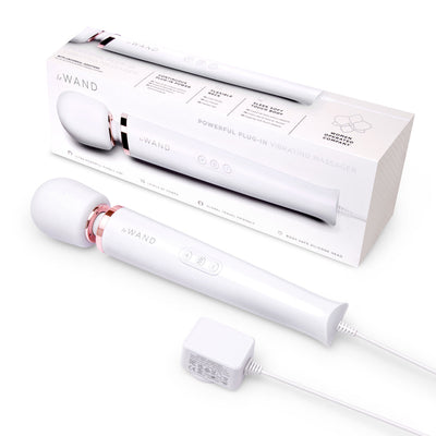 Le Wand Plugin Sky White vibrating massager with long cord and charger next to its packaging box.