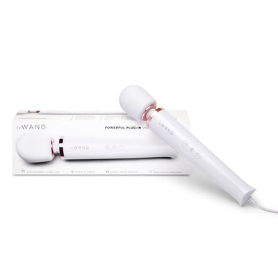 Le Wand Plugin Sky White vibrating massager with rose gold accents and packaging box on white background