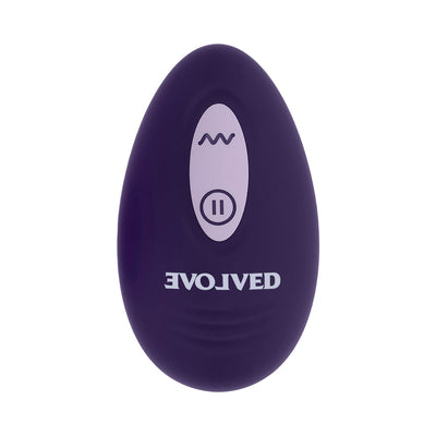 Purple oval-shaped remote control with wave and pause buttons, branded with Evolved logo in white.