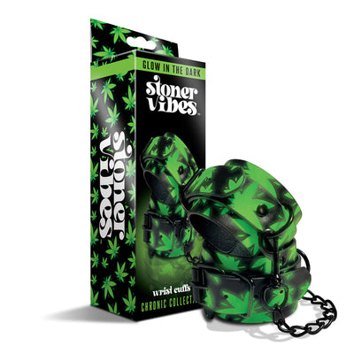 Glow in the dark wrist cuffs with green cannabis leaf design and black chain, displayed with matching packaging box.