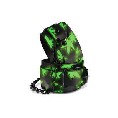 Glow in the dark black ankle cuffs with green leaf pattern and metal chain clasp from Stoner Vibe Chronic Collection.