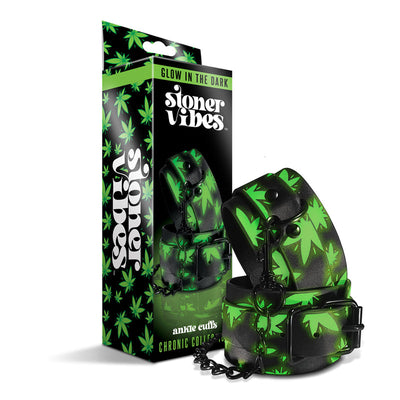 Glow in the dark ankle cuffs with green leaf pattern and black chain from Stoner Vibes Chronic Collection in branded packaging.