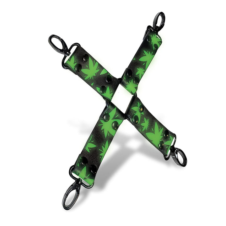 Glow-in-the-dark black faux leather hogtie with green cannabis leaf pattern and black metal clips in an X shape.