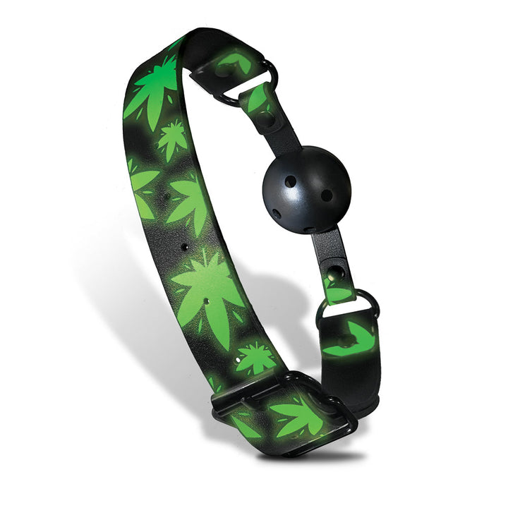 Glow in the dark breathable ball gag with green cannabis leaf design and adjustable black strap