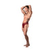 Male model wearing burgundy strappy cutout thong with lace and floral pattern, posing with arms raised against white background.