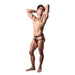 Male model wearing Male Power Lucifer Strappy Jock in black with lace pouch and elastic straps, posing with arms raised.