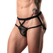 Close-up of male model wearing black lace strappy jock with elastic waistband and leg straps, showcasing fit and design.