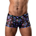 Close-up of a man wearing black mesh pouch shorts with colorful holographic mushroom patterns.