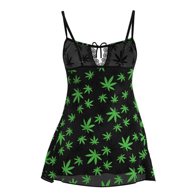 Black mesh slip dress with green leaf pattern, adjustable straps, lace trim, and front tie detail.