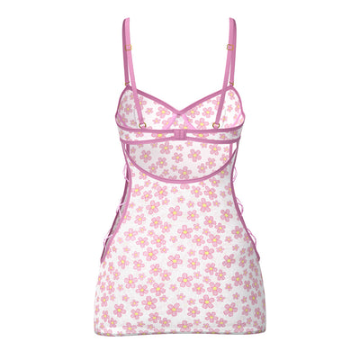 Sheer mesh mini dress with pink daisy print, adjustable lilac straps, and matching tanga set, back view.