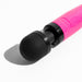 Close-up of Doxy Die Cast 3 compact wand vibrator in glittery hot pink with black rounded head on white background.