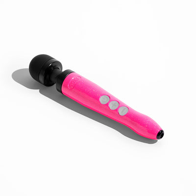 Compact rechargeable wand vibrator in glittery hot pink with black rounded head and three control buttons on the handle.