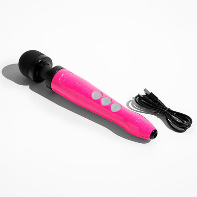 Compact rechargeable wand vibrator in glittery hot pink with black head and USB charging cable on white background