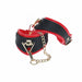 Black and red bonded leather leg cuffs with gold-tone chain and hardware from the Ouch! Milan Collection