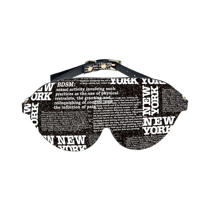 Black bonded leather blindfold with white New York text and printed script, adjustable buckle strap design.