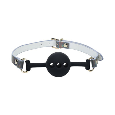 Black silicone ball gag with three ventilation holes and adjustable white bonded leather strap with iridescent hardware.