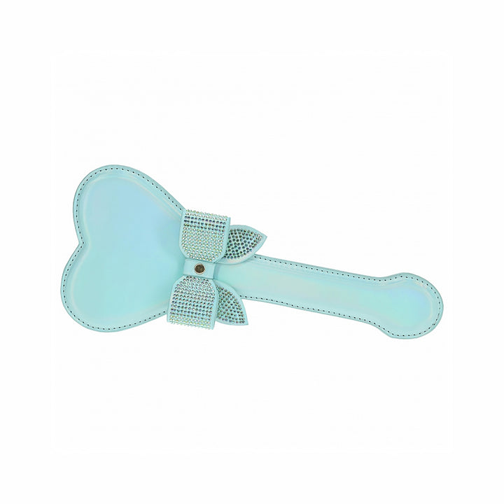 Light blue heart-shaped paddle with iridescent finish and rhinestone-studded bow detail on handle.
