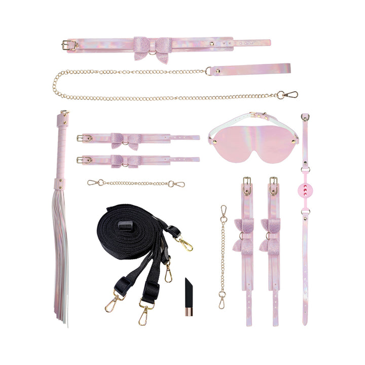 Ouch! Paris Collection Kit with iridescent collar, leash, cuffs, blindfold, ball gag, flogger, restraints, and vibrating bullet on white background
