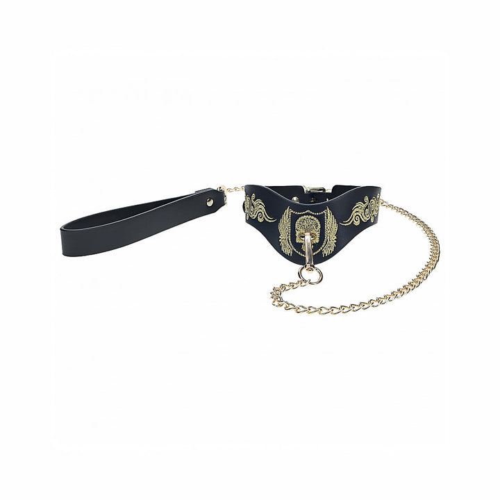 Black bonded leather collar with gold embroidered design and matching gold chain leash with black handle.