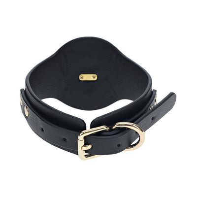 Black bonded leather leg cuff with gold-tone buckle and hardware, designed for adjustable and secure fit.