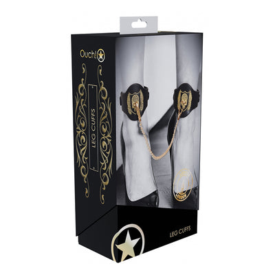 Packaging of Ouch! London Collection Leg Cuffs featuring black ankle cuffs with gold chain and decorative gold emblem.