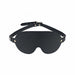 Black bonded leather blindfold with adjustable strap and gold-tone hardware from the Ouch! London Collection.