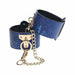 Blue textured bonded leather handcuffs with gold-tone chain and hardware from the Ouch! Florence Collection.