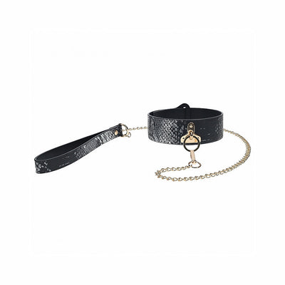 Black textured collar with gold chain leash and matching wrist strap from the Ouch! Florence Collection.