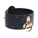 Black faux snakeskin leather handcuff with gold-tone hardware and a circular ring detail.