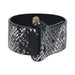 Black and silver snakeskin-patterned bonded leather handcuff with gold-tone hardware from the Florence Collection.
