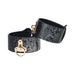 Black faux snakeskin leg cuffs with gold-tone hardware and adjustable straps from the Ouch! Florence Collection.