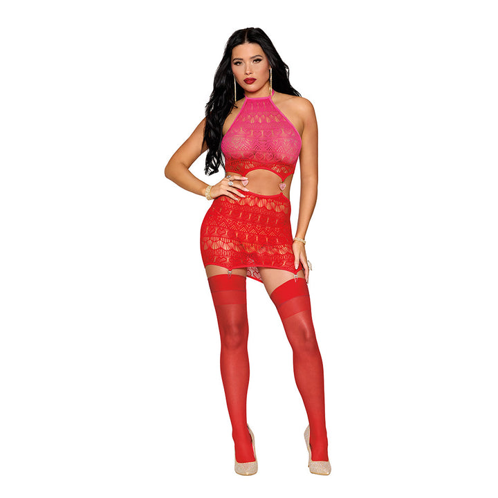 Woman wearing a pink and red heart-patterned garter teddy with attached garters and red thigh-high stockings.