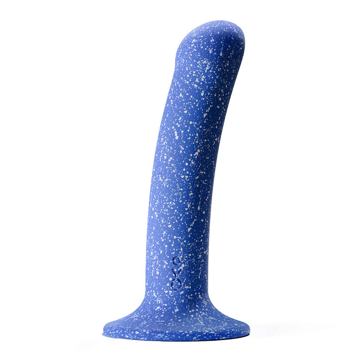 Blue silicone dildo with white speckled pattern and suction cup base standing upright on white background