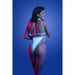Back view of model wearing iridescent glow-in-the-dark cut-out harness bodysuit in soft blue under moody lighting